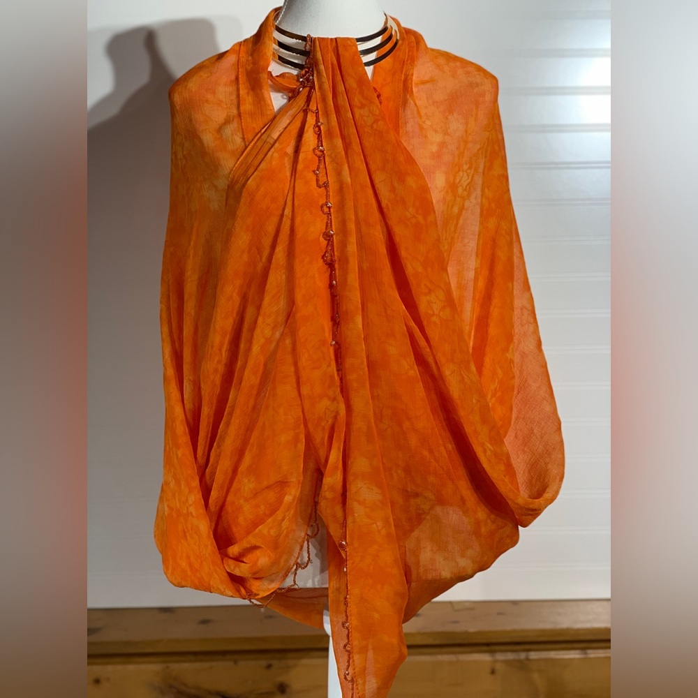 2 beautiful orange scarves bundled. One with beading,‎ then other with sparkle.